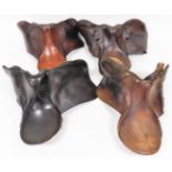 Four various leather riding saddles, to include one in black, 43cm wide seat, jumping saddle, etc. (
