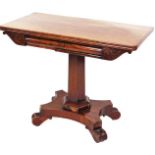 A Victorian mahogany fold over tea table, with a carved bell flower and scroll frieze on a hexagonal