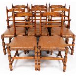 A set of eight (6+2) dining chairs, with overstuffed leather seats on turned front legs, joined by a