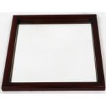 An early 20thC mahogany framed mirror, of square form with plain glass, 46cm x 46cm.
