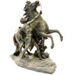A late 19thC spelter classical figure group, of rearing horse and classical semi clad figure on shap