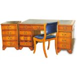 A late 20thC desk, the rectangular top with canted corners, with a tooled leather style section abov