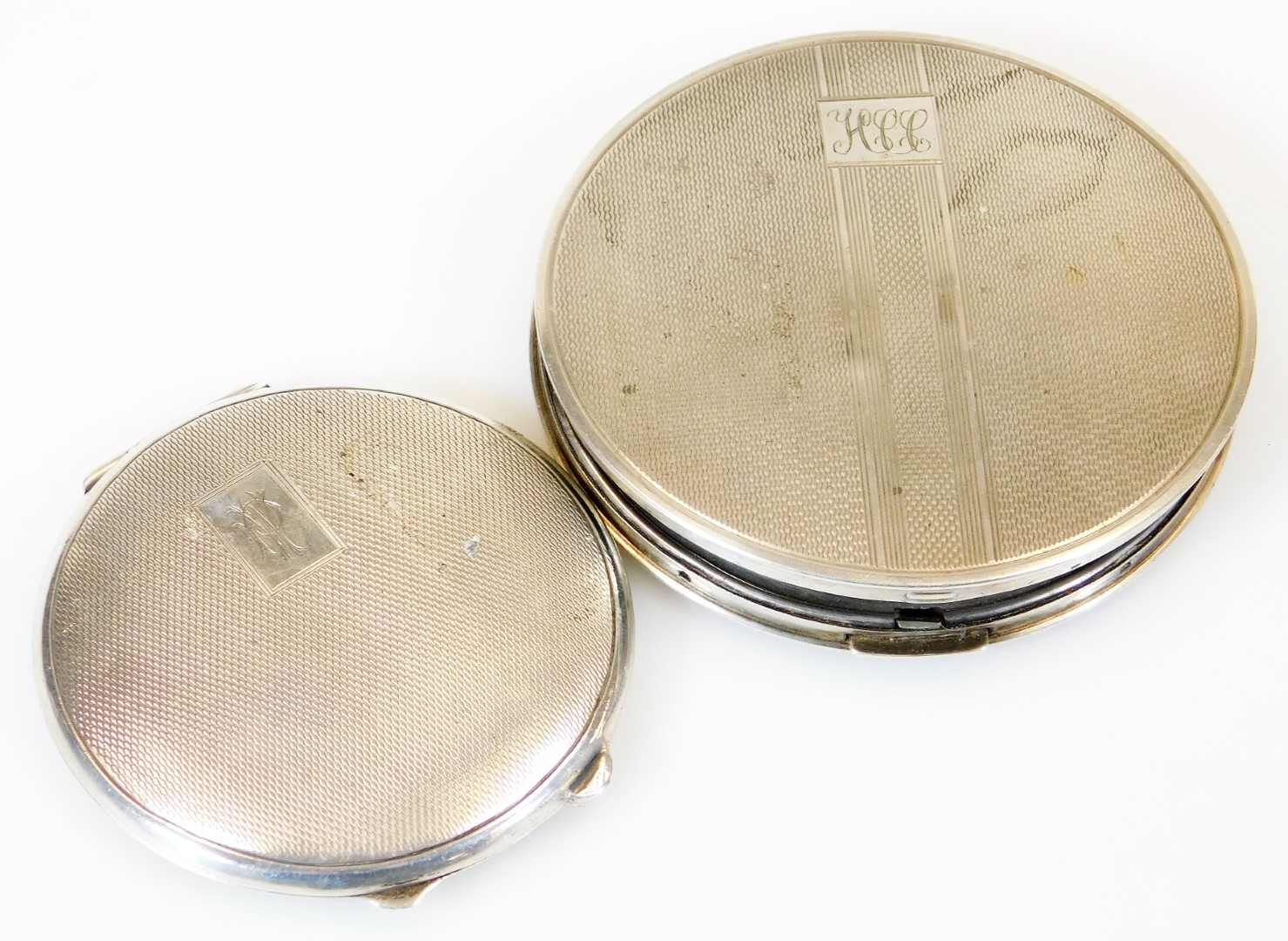 A George VI silver powder compact, of circular form, partially engine turned and initialled with a p