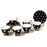 A Royal Albert six piece coffee set, comprising cups and saucers in a black and white spot pattern w