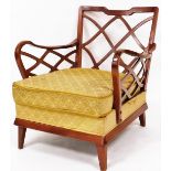 A 1940s Swedish mahogany framed low armchair, with shaped lattice splat, moulded arms and squat tape