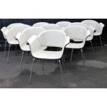 A set of ten Bene retro chairs, with cream arms and seats, on shaped chrome legs, label beneath, 82c