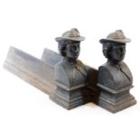 A pair of early 20thC cast iron andirons, formed as figures of ladies, quarter profile wearing hats,