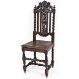 A 19thC ebonised oak Carolean chair, the cresting rail set with two lions with central shield, above