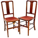 A pair of Edwardian mahogany and boxwood strung salon chairs, each with overstuffed seats on square