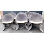 A set of seven Pieff garden chairs, wicker style, with chrome frames and florally upholstered seats,