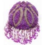 A 20thC hanging lantern shade, with amethyst coloured orbs and tassels on a glass ground set with el