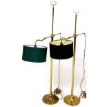 A pair of 20thC brass lamp standards, with adjustable arms and circular bases, each surmounted by sh