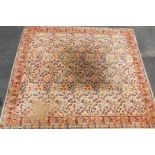 A Boltonian Seemless square rug, in floral pattern, decorated predominantly in red, blue and yellow,