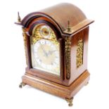 A late 19thC mahogany cased bracket clock, with arched dial in a fitted case with turned spandrels f