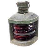 An early 20thC S Fay and Sons corner port light, with red glass centre and shaped case with cylindri