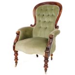 A Victorian mahogany framed spoon back chair, with button back arms and serpentine seat in later gre