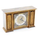 A Hoppers Elliot and Co oak cased mantel clock, of rectangular form, the 9cm diameter dial, with 8cm