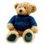 A Harrods plush jointed 1998 teddy bear, wearing turquise jumper, 36cm high.