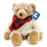 A Harrods plush jointed 2002 teddy bear, wearing tartan scarf and cream jumper, with label to the ea