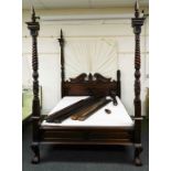 A 20thC hardwood four poster bed, composed with four turned posts set with acanthus leaf and flower