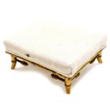 An early 20thC Aesthetic style bamboo overstuffed foot stool, of rectangular form, in floral cream m