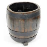 A stained oak coopered barrel, with double metal banding on shaped feet, probably 20thC, 45cm high,