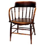 A 1920's oak bentwood Thonet style armchair, with shaped cresting rail on turned supports, on ring t