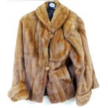An early 20thC ladies fur coat, quarter length with lining, in brown, size unknown.