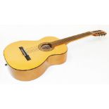 A 20thC guitar, with shaped body, six strings and six shaped tuning knops, 100cm wide.