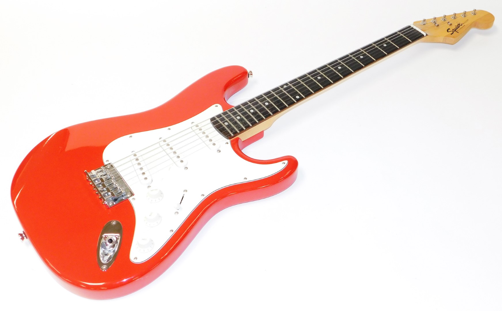 A Squier Fender Bullet six string electric guitar, in red and white colourway, 101cm wide, in associ