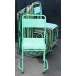 A set of twelve bent metal stacking chairs, with metal shaped backs and pierced seats on turned fro