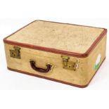 A vintage pressed cream leather finish travel case, with brass lock and brown leather extremities wi