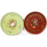 Two early 20thC Toleware style tin plates, each of circular form, hand painted with flowers, with a