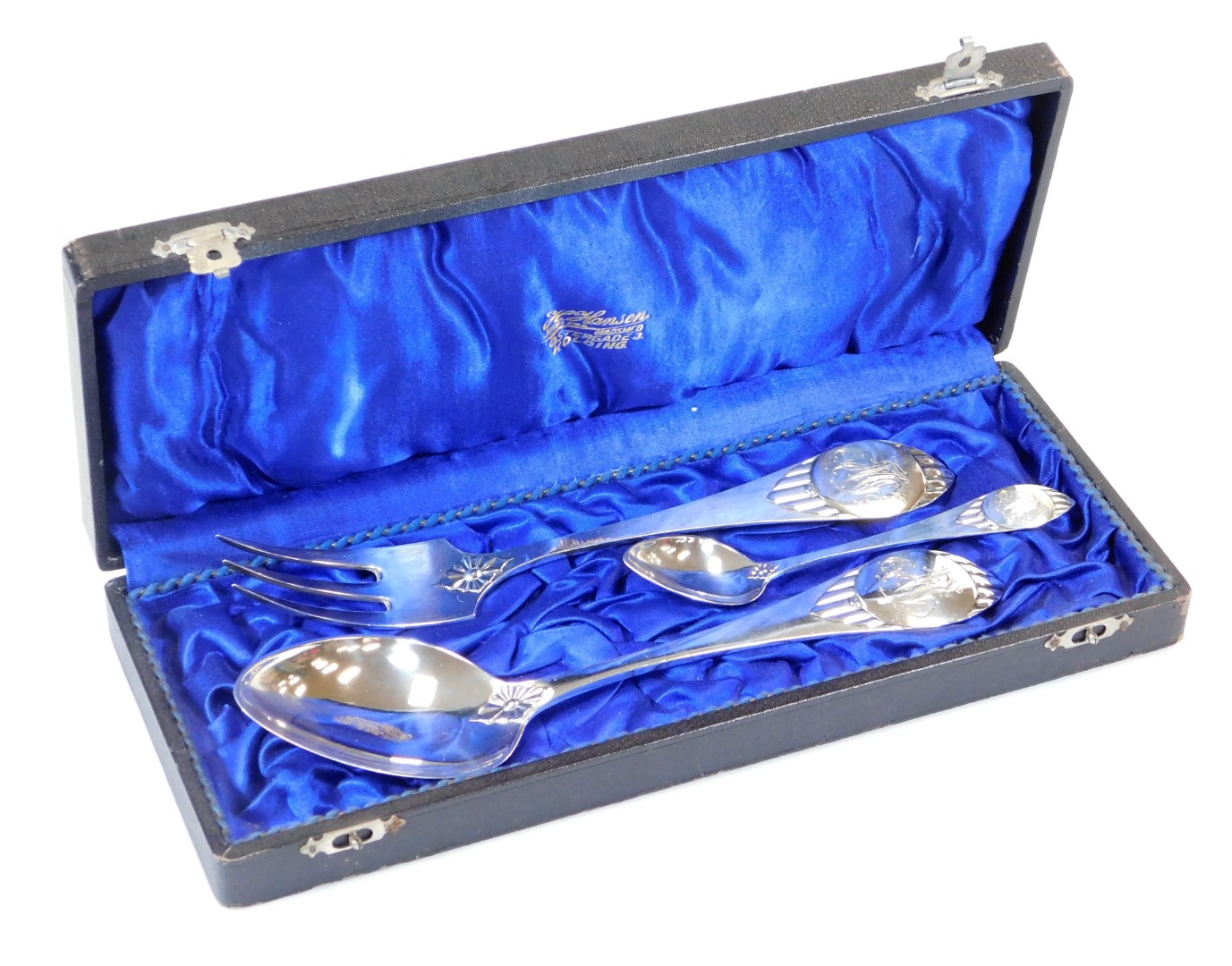 A cased early 20thC Scandinavian three piece service, comprising serving spoon and fork and teaspoon