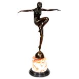 After Philipp. An Art Deco style bronzed and marble finish figure of dancing girl with arms outstret