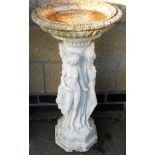 A late 20thC bird bath, with circular top, raised on a Three Graces stem, terminating in a stepped
