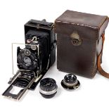 A 20thC Zeiss Ikon camera, with various accessories including enlarger lenses, and leather case, wi