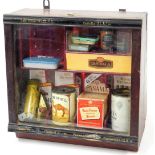 An advertising retailer's table display cabinet, with front opening marked cafe creme, partially ebo