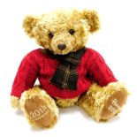 A Harrods plush jointed 2005 20th anniversary teddy bear, in brown, wearing red jumper and Burberry
