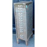 A Constructors Electriques metal 15 drawer narrow filing cabinet, on tapering legs, in green, 102cm