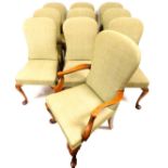 A set of nine (8+1) Beresford & Hicks walnut framed dining chairs, each with elongated spoon backs a