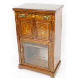 An Edwardian rosweood Sheraton revival cabinet, of rectangular form with a plain moulded top raised