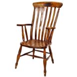 A 19thC ash and elm lathe back chair, with cone topped cresting rail, vertical splat, shaped seat an