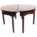 An early 19thC mahogany circular dining table, in two sections, on chamfered legs, 75cm high, 121cm