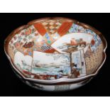 A Japanese lobed Satsuma bowl, decorated overlapping shaped panels depicting women and children in a