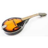 A late 20thC Stagg mandolin, model M-20 in a bicoloured case with eight chrome finish tuning knops,
