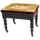 A late 19thC ebonised walnut piano stool, with rectangular overstuffed petit point top, on turned le