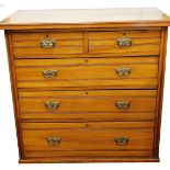 An Edwardian satin walnut chest, of two short and three long drawers, with plate back handles, on a