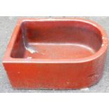 A fire clay trough, of D-end form, 28cm high, 60cm wide, 47cm deep.