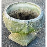 A late 20thC classical design urn, raised with garlands on an inverted stem and sqaure foot, 34cm hi